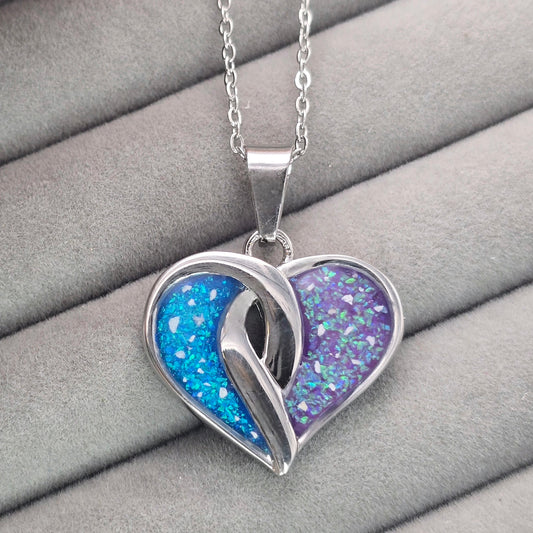 Stainless steel crossover heart pendant
