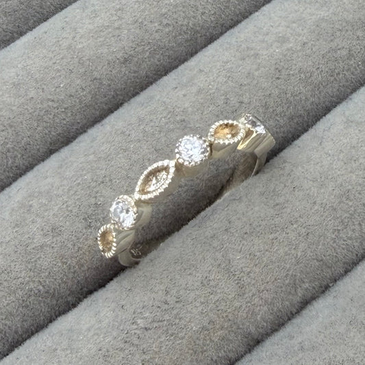 Serrated bezel half marquise cz ring