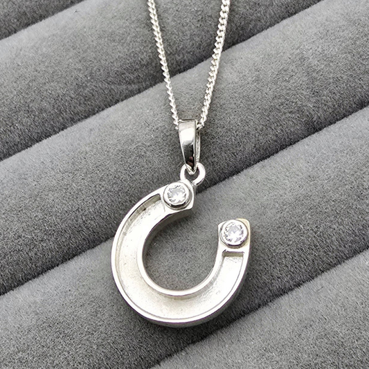 CZ horse shoe pendant